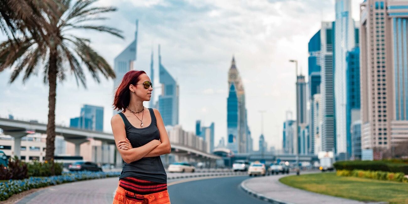 Person wearing sunglasses in bright Abu Dhabi sunshine